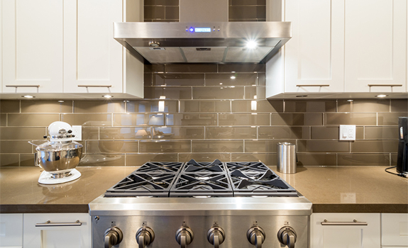 Stove closeup in modern kitchen interior with stainless steel gas cook-top